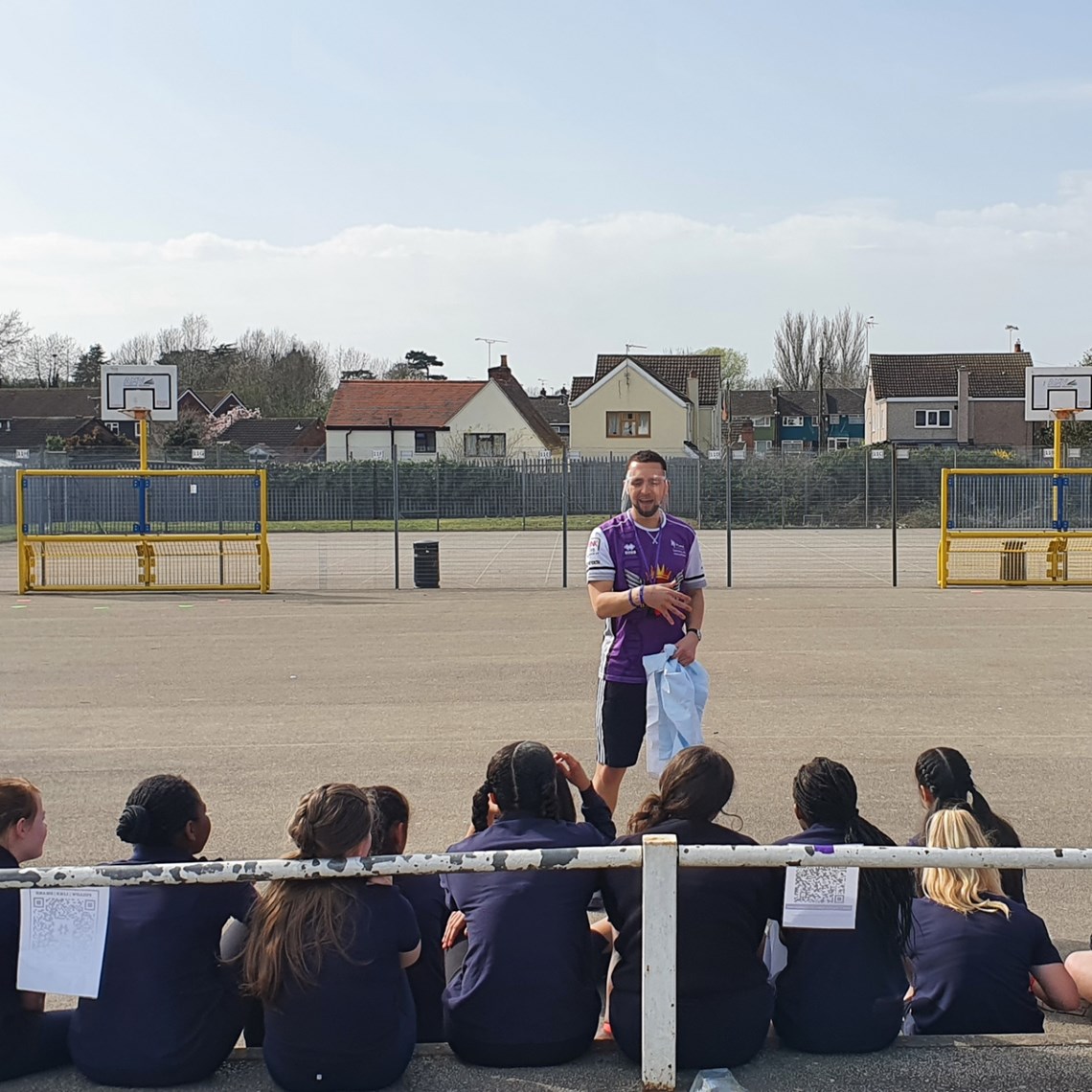 Guardian Ballers Kieran Joseph coaches a group of school children